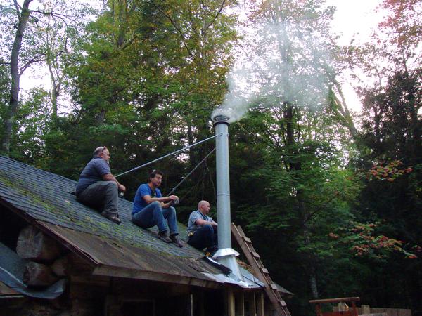 Mikey, Jon, and Jim relaxing as the new smoke stack gets its first use.