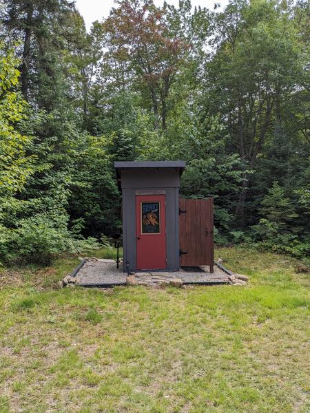 Outhouse (and shower) at the Seney Bridge Hunt Club camp.