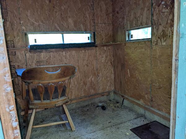 Inside of the deer blind. The pad on the floor is for a small wood stove.