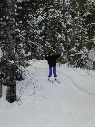 Vittoria skiing down the deadly path back to the cabin.
