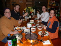 Jon, Bill, Vittoria, and Amelia eating black beans and rice.