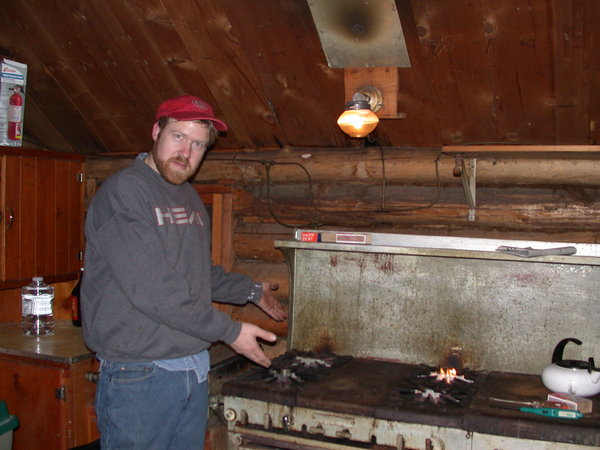 Bill showing off the cleaned out burners (and how well
		  they now work).