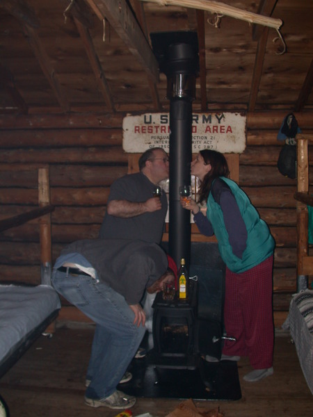 Bill, Jon, and Vittoria kissing the new stove.