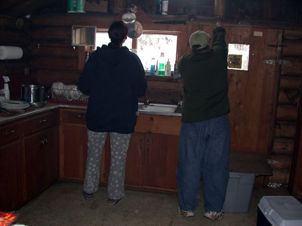 Vittoria and Jon cleaning up from breakfast and preparing
		for a late lunch.