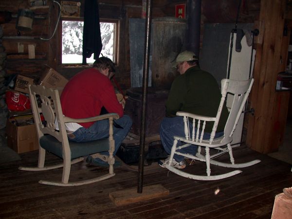 Bill and Jon relaxing near the woodstove.