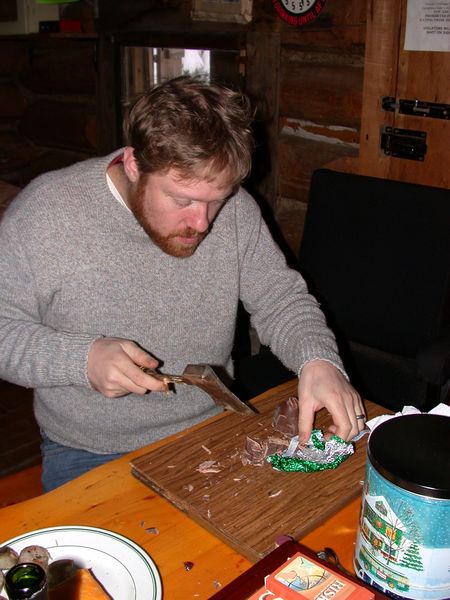 Bill working on the Hersheys kiss.  It being the Cabin he
		"improvised" on his tool of choice.