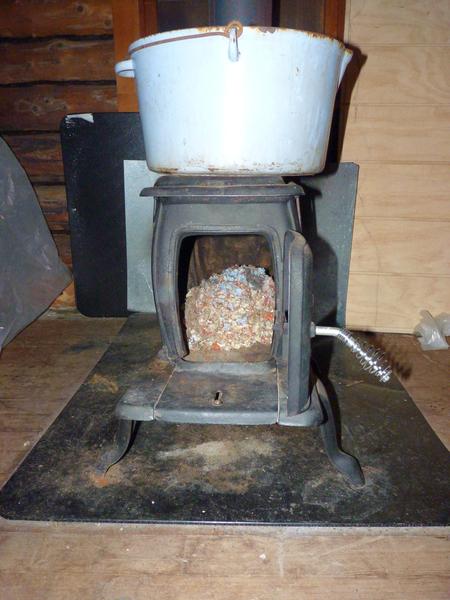 A huge mouse nest in the small wood stove.