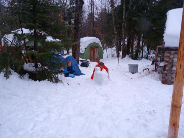 Frankie and Teddy building a snow wall.