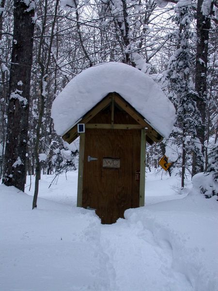 Outhouse with a snowshoed path to it.
