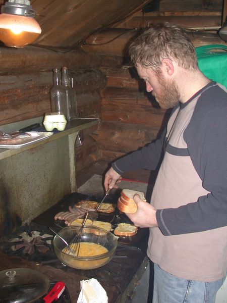 Bill making one of his huge breakfasts on the builtin griddle on the stove.