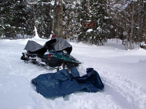 The fine parking job of the snowmobile.