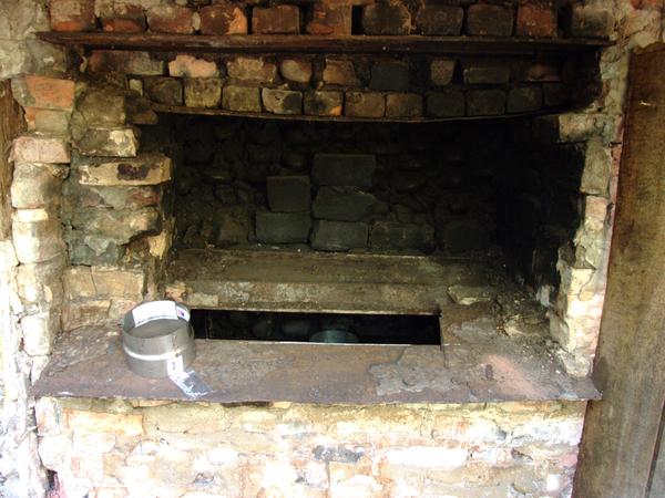Old fireplace opening ready for the installing of the new smoke stack.