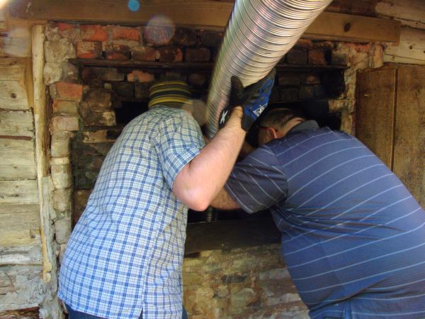 Mikey and Jon starting the installation of the new smoke stack.
