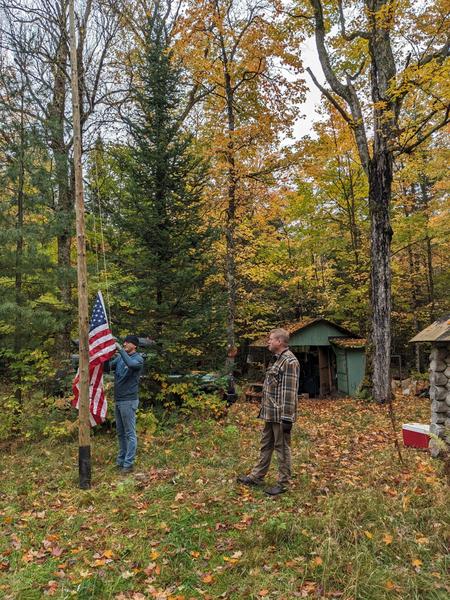 Mikey and Bill raising the flags.