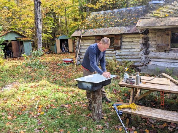 Bill giving the sink a thorough cleaning.