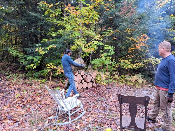 Mikey hauling logs from the downed (huge) tree limb.