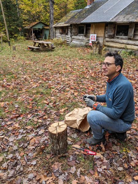 Mikey preparing to light a Swedish log.