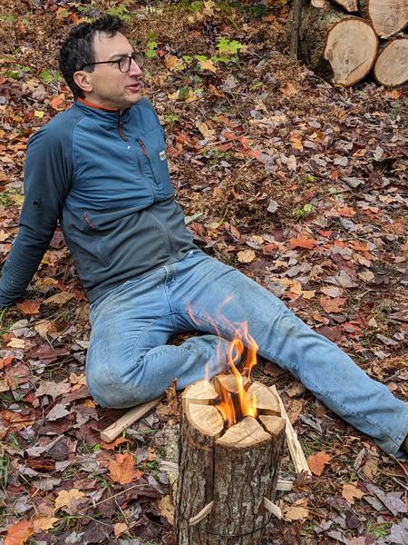 Mikey relaxing by the burning Swedish log.