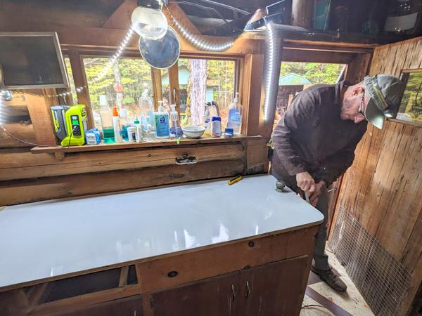 Andy smoothing the edges on the new countertop.