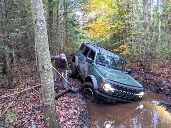 Andy working to get the Bronco out of a deep hole. (Near where Ted had gotten his truck stuck.)