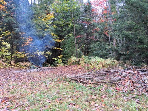 The remains of the brush pile after a weekend of burning.