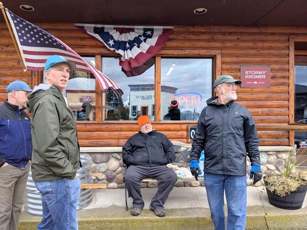Jim, Ed, Jon, and Arthur waiting outside the hardware store in Grand Marais.