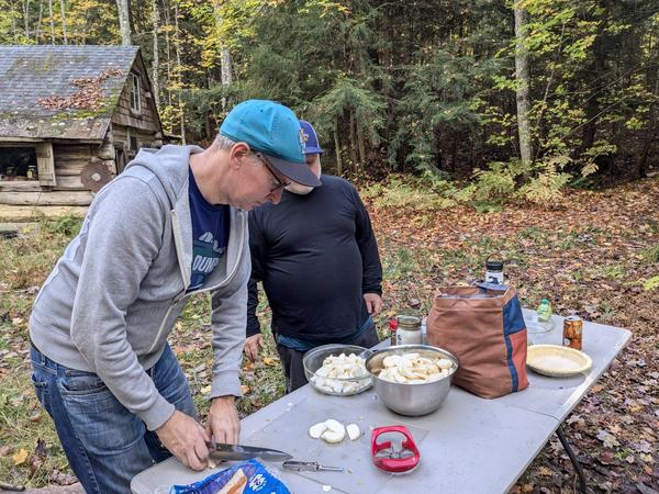 Ed and Jon preparing apples for some apple pies.