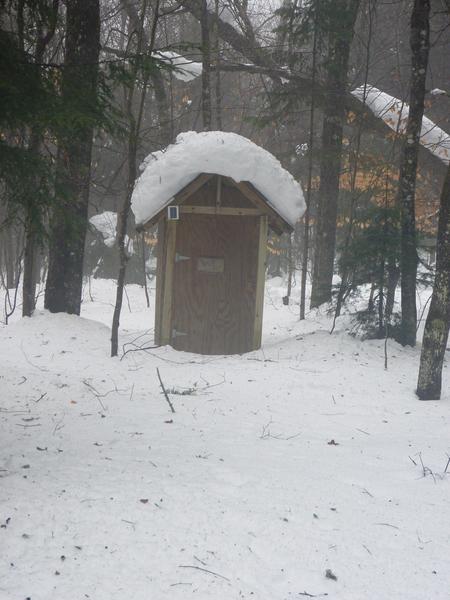 The outhouse as seen through the fog.