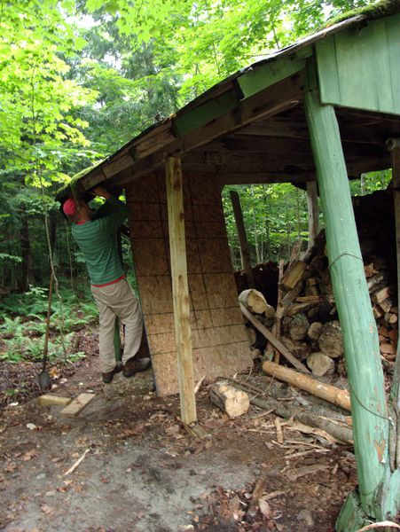 Bill working on bracing a corner of the wood shed.