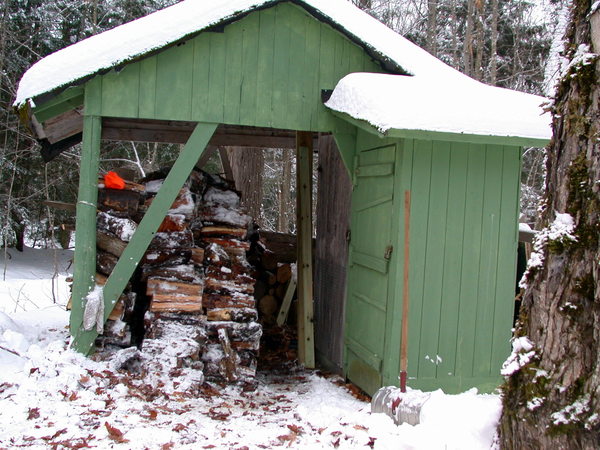 All the newly delivered wood stacked for drying/storage.