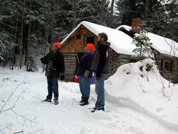 Bill, Jon, and Carl looked at an old, dead tree that needs to be cut down.