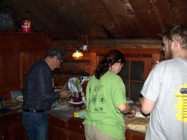 Carl, Vittoria, and Bill cooking in the kitchen.