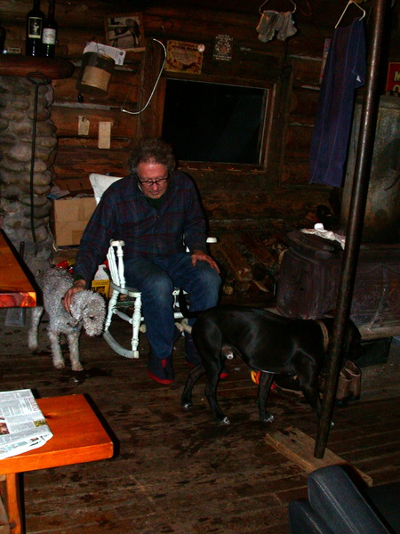 Carl with Zuzu and Dog by the woodstove.