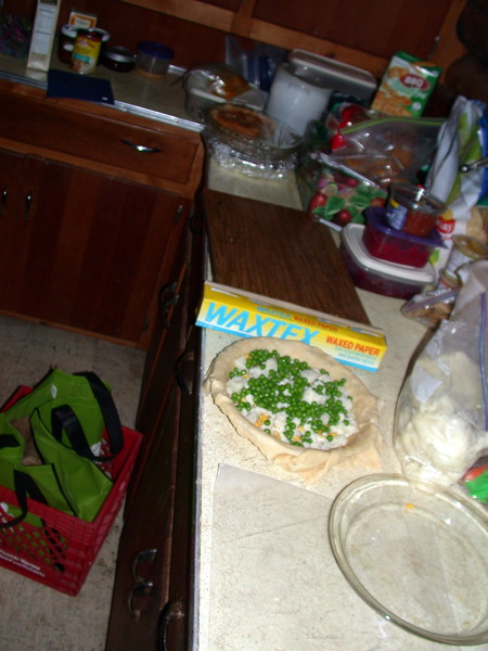 One of the pot pies being put together.