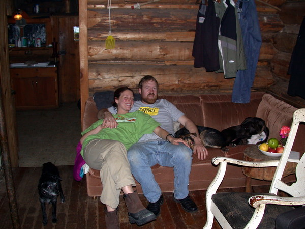 Vittoria and Bill with Abby and Dog on the couch and Scozi standing nearby.