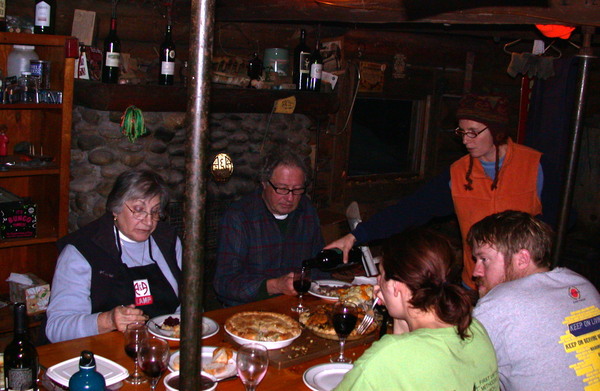 Rose, Carl, Amelia, Bill, and Vittoria eating dinner.